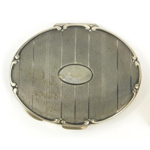 205 - Japanese musical compact, circular Japanese compact and a silver metal compact, the largest 7.5cm di... 