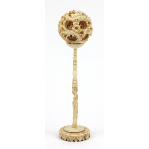 617 - Oriental Chinese carved ivory puzzle ball on stand, 16cm high