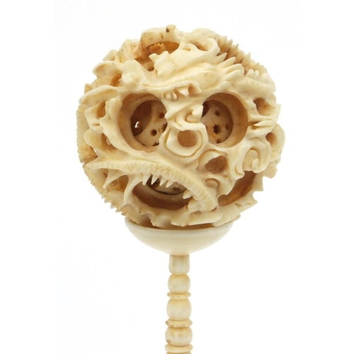 617 - Oriental Chinese carved ivory puzzle ball on stand, 16cm high