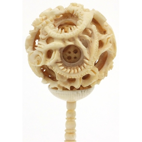 617 - Oriental Chinese carved ivory puzzle ball on stand, 16cm high