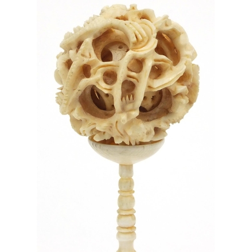 617 - Oriental Chinese carved ivory puzzle ball on stand, 16cm high