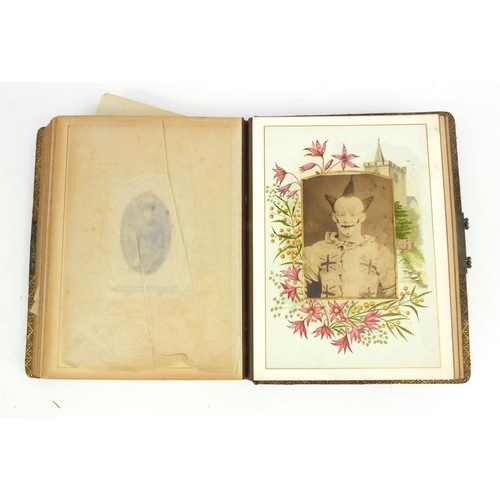 251 - Edwardian cabinet card album containing cabinet cards including one of a clown and families, etc