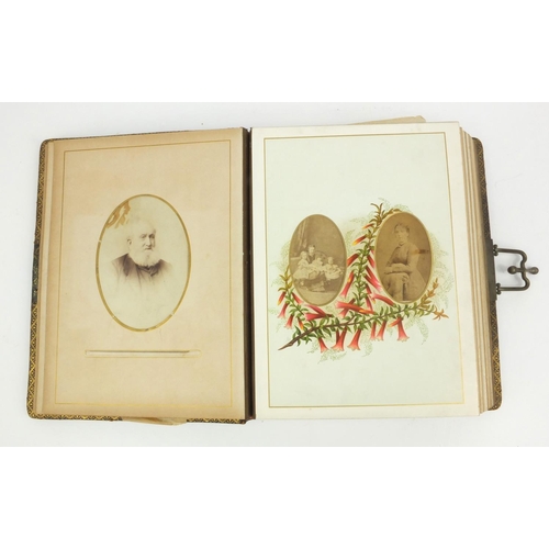 251 - Edwardian cabinet card album containing cabinet cards including one of a clown and families, etc