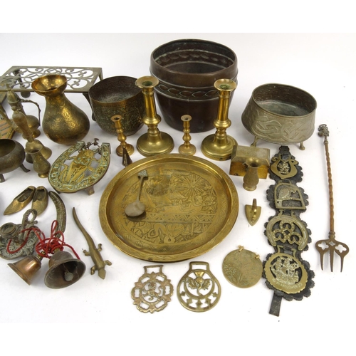 457 - Assorted copper and brass items including trays, trivet, horse brasses, Middle Eastern items, etc