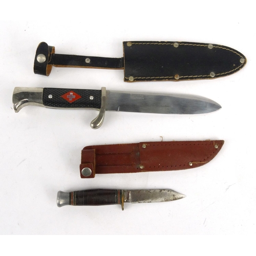711 - Military interest dagger with leather sheath and a small hunting knife with sheath