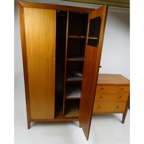 30 - Teak two door wardrobe and a three drawer chest with label 'Designer Made by Storys, Kensington, Lon... 