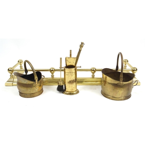 453 - Brass fender, two coal buckets and a companion set