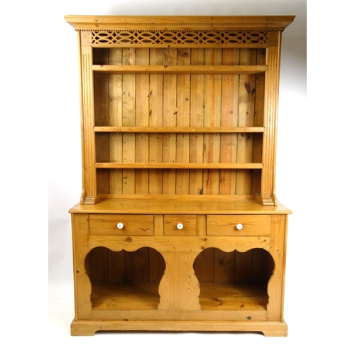 32 - Pine dresser fitted with open plate rack above three drawers and open base, 218cm high x 151cm wide ... 