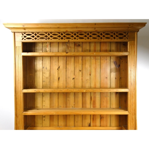 32 - Pine dresser fitted with open plate rack above three drawers and open base, 218cm high x 151cm wide ... 