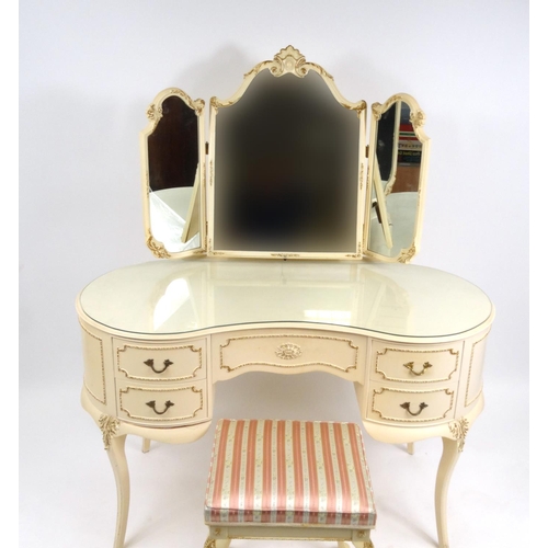13 - Cream and gilt bedroom suite comprising, kidney shaped dressing table with mirrored back and with st... 