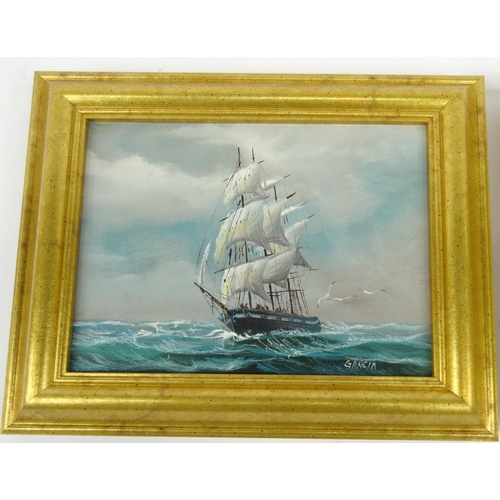 538 - Two gilt framed oil onto canvas views of ships at sea, 26cm x 21cm excluding the frames