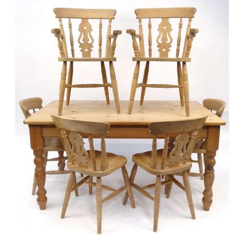 4 - Rectangular pine dining table and six chairs including two carvers, the table 77cm high x 152cm long... 