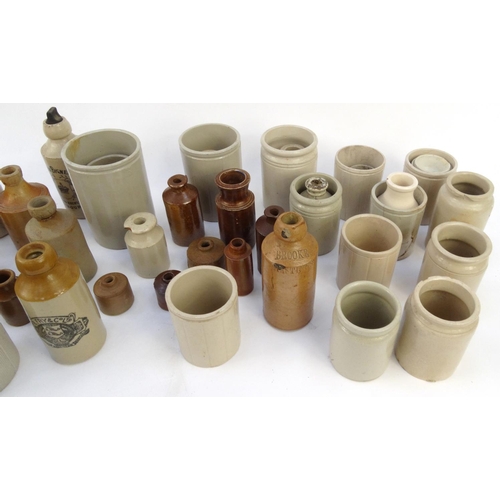 516 - Large selection of assorted stoneware advertising bottles