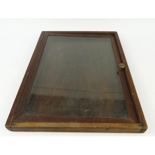 448 - Oak wall hanging noticeboard with hinged glass door, 69cm high x 52cm wide x 5cm deep