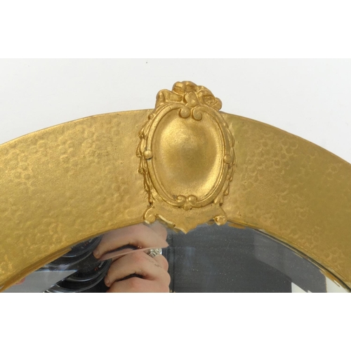 6 - Gilt metal oval bevel edged mirror, 81cm long x 56cm wide