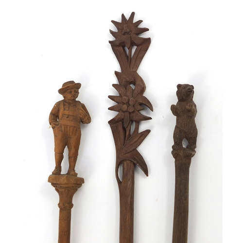 104 - Three carved wooden Black Forest dip pens - one with a bear, the largest 22cm long