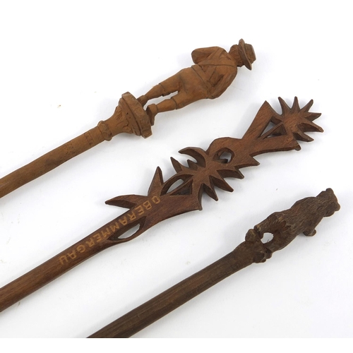 104 - Three carved wooden Black Forest dip pens - one with a bear, the largest 22cm long