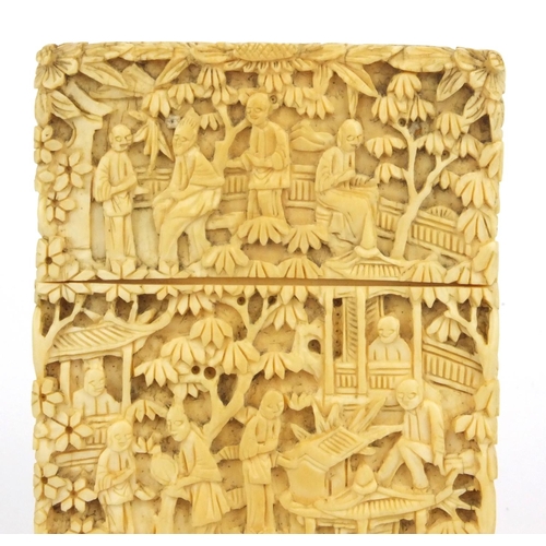 613 - Oriental Chinese ivory card case carved with scenes of elders, pagodas and trees, 9.5cm high