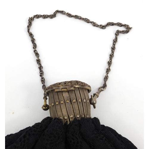 181 - Lady's crochet handbag with expanding metal top and clear and black glass tassels, 30cms tall