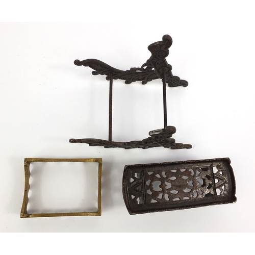 108 - Two Victorian cast iron pen stands and a brass example, the largest 12cms high