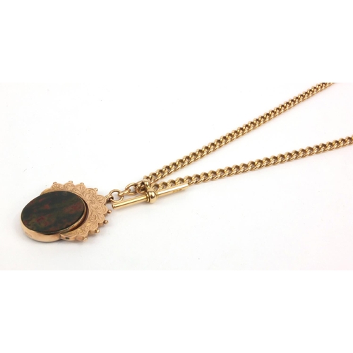 1286 - 15ct gold watch chain with T-bar and large 9ct gold hardstone spinner fob, the chain 36cm long, appr... 