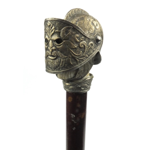 62 - Walking stick, the pommel modelled as a knight's head wearing a helmet, with moveable visor, the sti... 