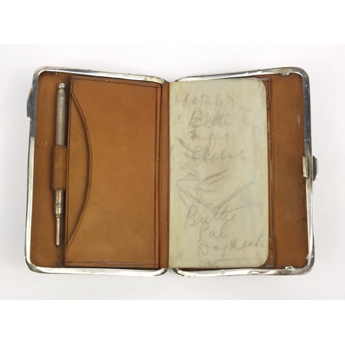 190 - Rectangular silver purse with propelling pencil and ivory page, the case with floral chased decorati... 