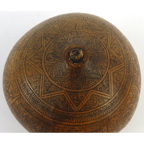 403 - Victorian penwork nut with scenes of storytelling, 10cm diameter