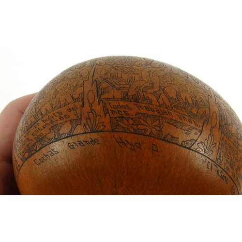 403 - Victorian penwork nut with scenes of storytelling, 10cm diameter