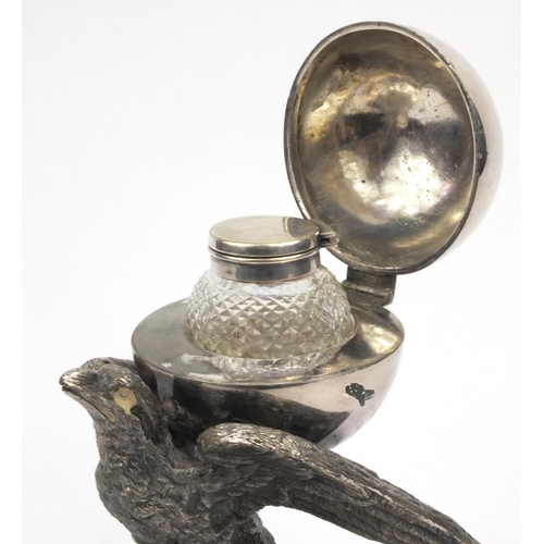 67 - Novelty silver plated desk inkwell of an eagle, 21cm high