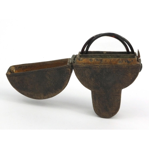 21 - Georgian shagreen spectacle case housing a pair of tortoiseshell framed spectacles, the case 7cm tal... 