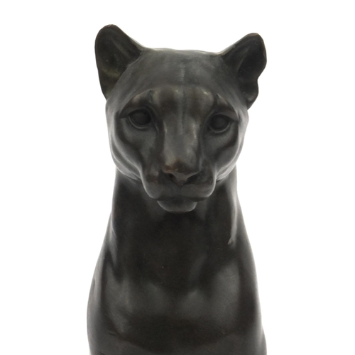 7 - French bronze cat, signed Césaro, raised on a marble base, 26cm high