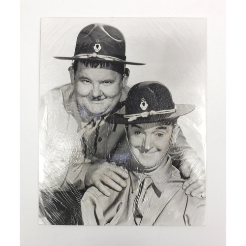 255 - Collection of Laurel and Hardy, Kermit the Frog black and white publicity photographs, each 25cms x ... 