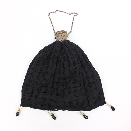 181 - Lady's crochet handbag with expanding metal top and clear and black glass tassels, 30cms tall