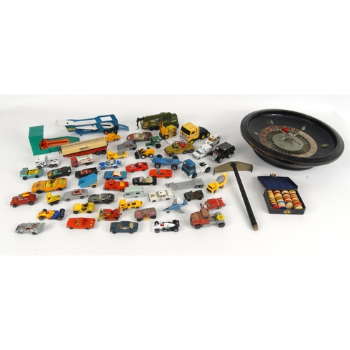 464 - Collection of die cast vehicles, mostly Matchbox examples, and a roulette wheel