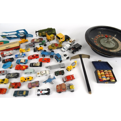 464 - Collection of die cast vehicles, mostly Matchbox examples, and a roulette wheel