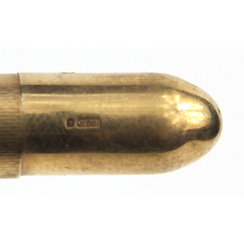 93 - Five propelling pencils including one 9ct gold example, the largest 12cm long