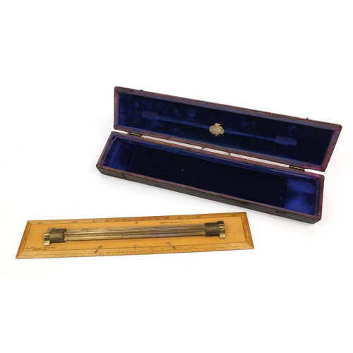 18 - Captain Field's Improved wooden and brass rolling ruler, Hudson & Sons, Greenwich, housed in a blue ... 