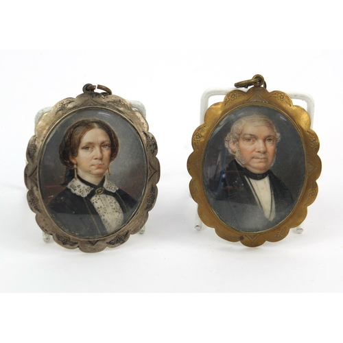 218 - Two Georgian hand painted portrait miniatures of a lady and gentleman, housed in unmarked silver fra... 