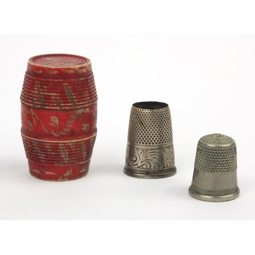 24 - Ivory ruler, together with a bone barrel shaped thimble case housing two silver coloured metal thimb... 