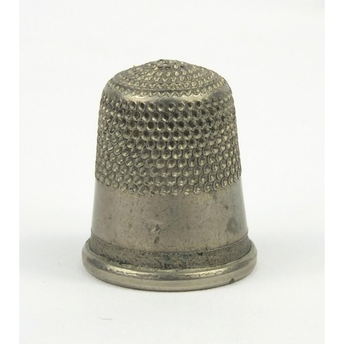 24 - Ivory ruler, together with a bone barrel shaped thimble case housing two silver coloured metal thimb... 