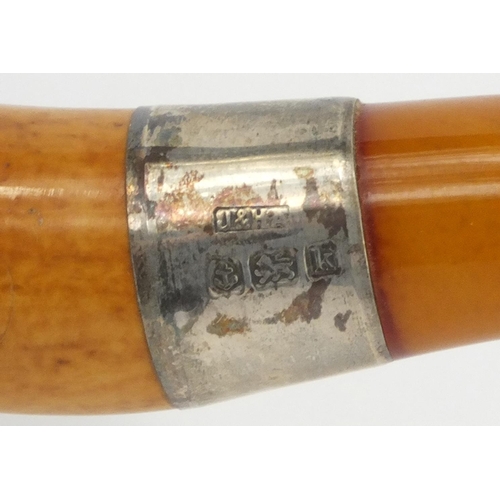 112 - Wooden pipe with amber coloured mouthpiece and silver collar, hallmarked Birmingham 1934-35, housed ... 