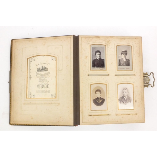 252 - Edwardian leather bound musical cabinet card album containing assorted family photographs, 30cm x 25... 