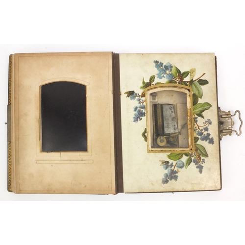 252 - Edwardian leather bound musical cabinet card album containing assorted family photographs, 30cm x 25... 