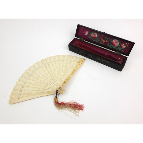 611 - Oriental Chinese ivory fan carved and pierced with figures, housed in a fitted wooden box, 21cm long