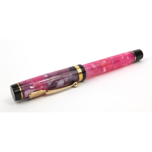 73a - Boxed Conway Stewart limited edition pink marbleised fountain pen 'Duro', the pen with gold band and... 