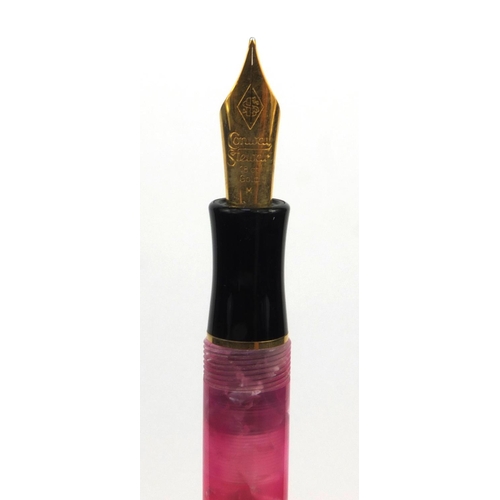 73a - Boxed Conway Stewart limited edition pink marbleised fountain pen 'Duro', the pen with gold band and... 