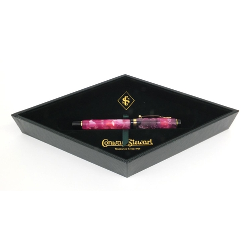 73a - Boxed Conway Stewart limited edition pink marbleised fountain pen 'Duro', the pen with gold band and... 