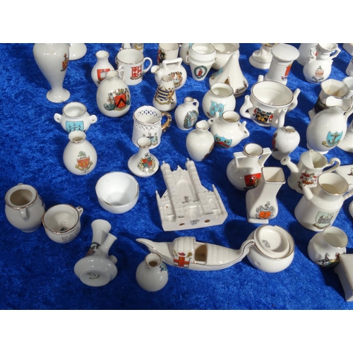 218 - Extensive collection of crested china including Goss, tank, lighthouses, bridge, animals, etc, and a... 