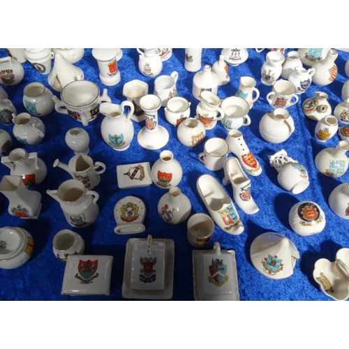 218 - Extensive collection of crested china including Goss, tank, lighthouses, bridge, animals, etc, and a... 